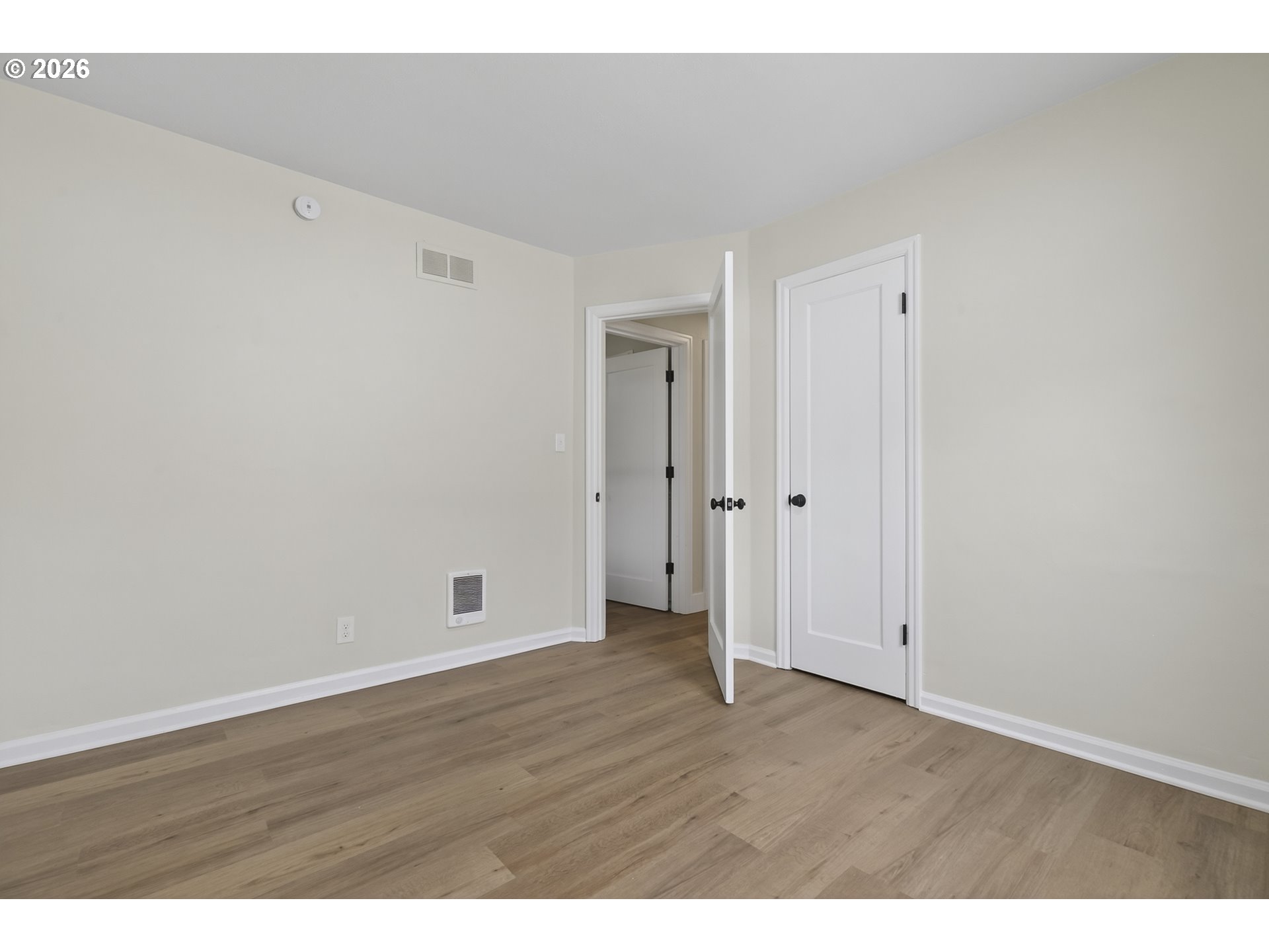 520 24th Avenue Longview, WA 98632 - Photo 26 of 37 a view of an empty room with wooden floor