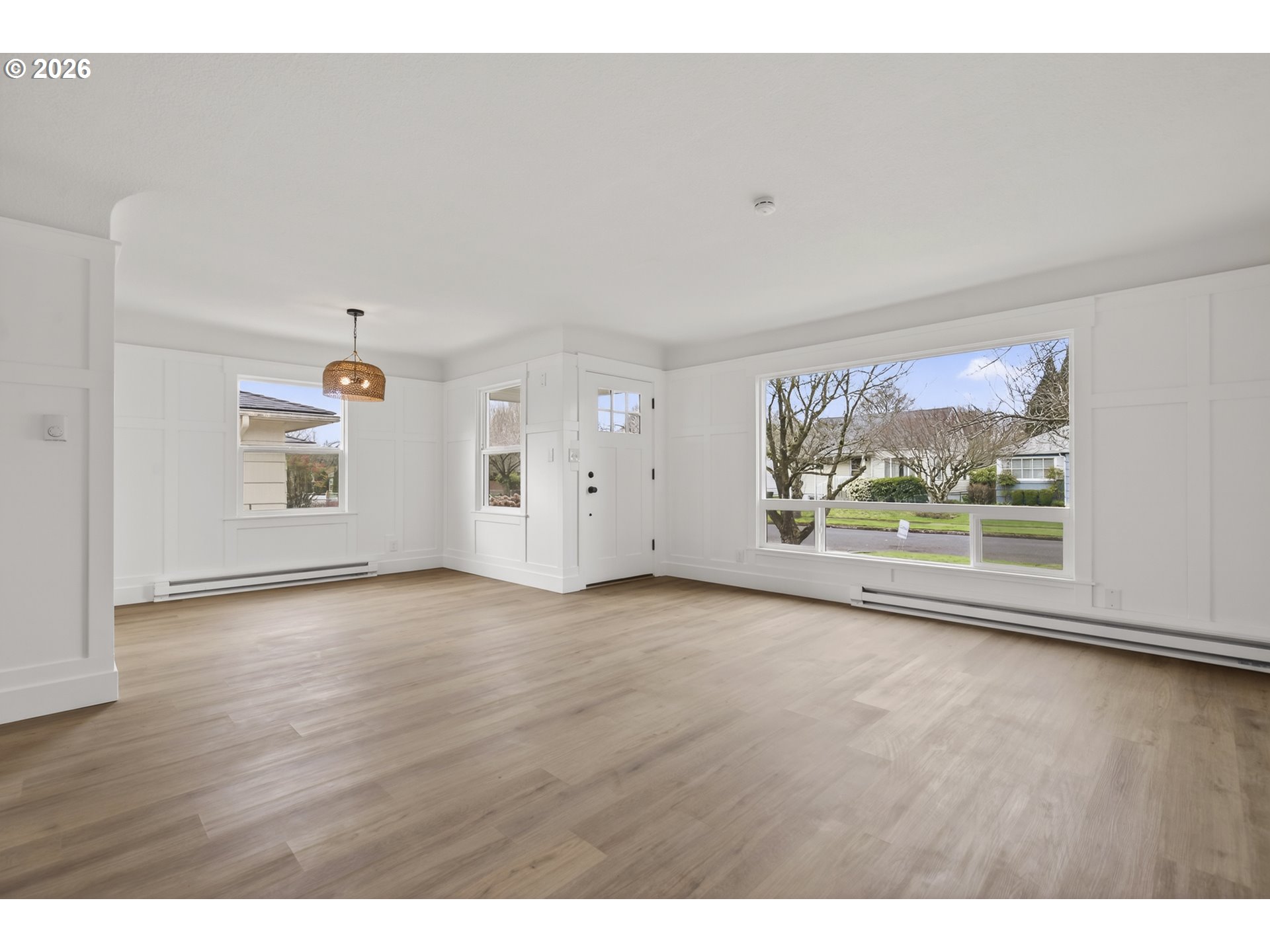 520 24th Avenue Longview, WA 98632 - Photo 9 of 37 a view of an empty room with a window and wooden floor