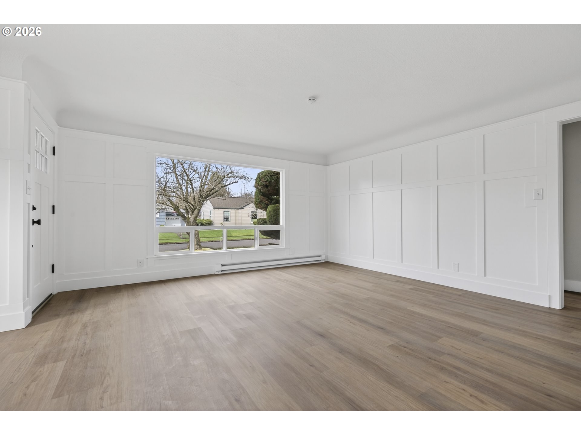 520 24th Avenue Longview, WA 98632 - Photo 10 of 37 a view of an empty room with a window and wooden floor