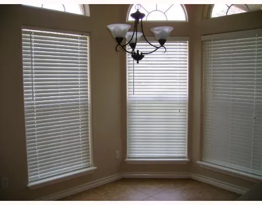a view of a house with a white window