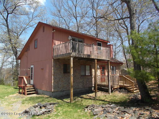 143 Weasel Road Dingmans Ferry, PA 18328 - Photo 2 of 14 a view of a house with a yard