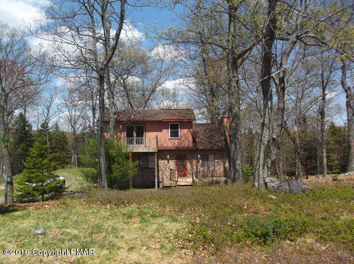143 Weasel Road Dingmans Ferry, PA 18328 - Photo 3 of 14 a view of a house with a yard