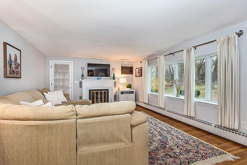 24 Erlin Road Chelmsford, MA 01824 - Photo 8 of 30 a living room with furniture or couch and a fireplace