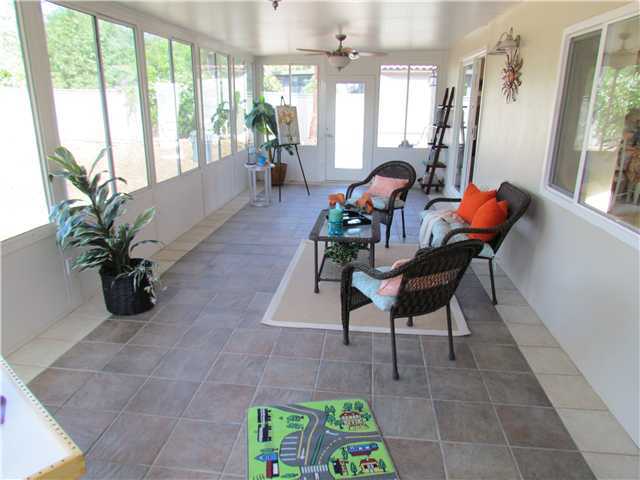 1512 Monte Mar Road Vista, CA 92084 - Photo 14 of 22 Permitted Sun room leading out to the backyard with tile flooring, plenty of lighting, windows, and ceiling fans