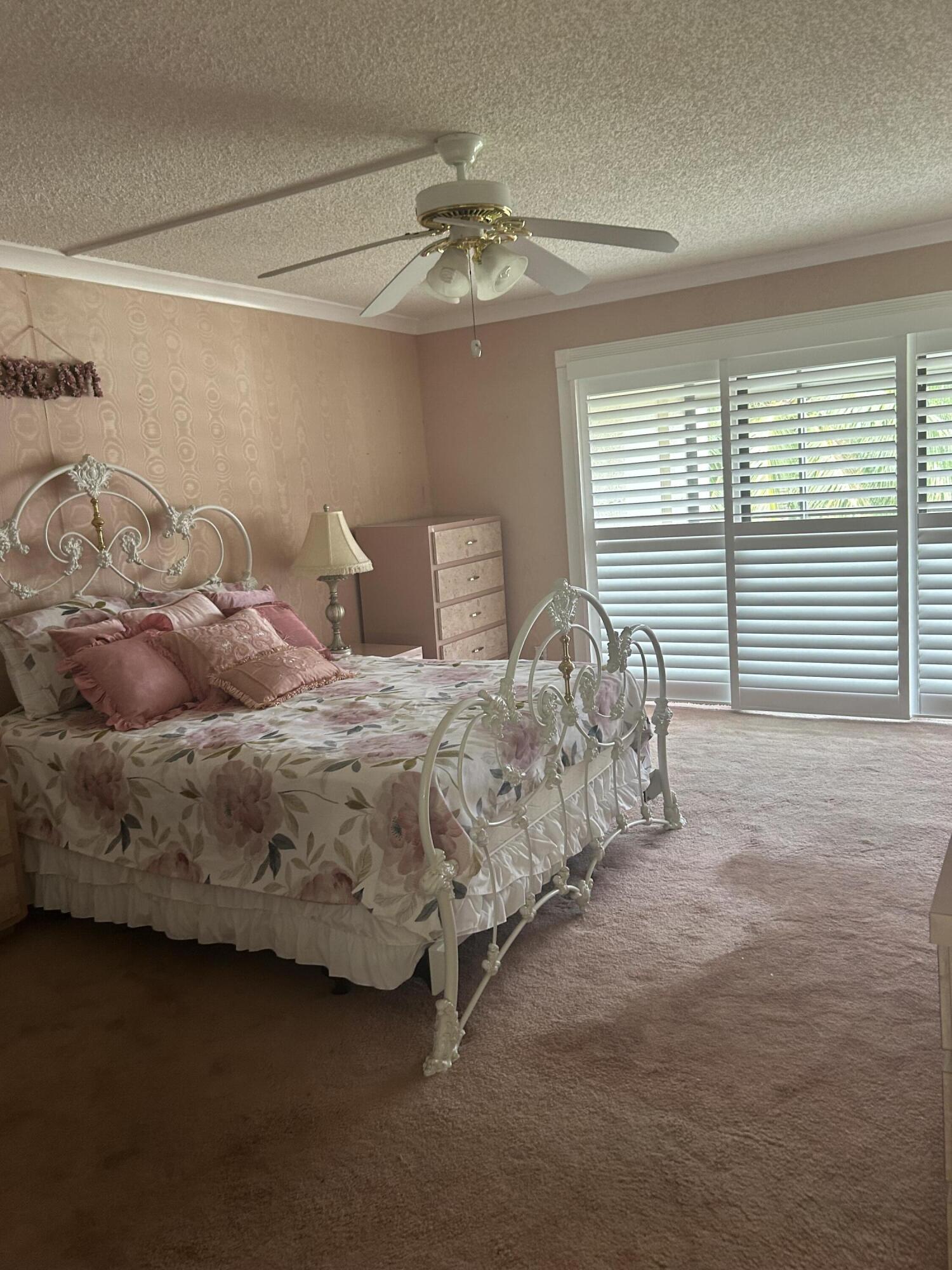 5650 Camino Del Sol, Unit 400 Boca Raton, FL 33433 - Photo 13 of 24 PRIMARY BEDROOM W/PLANTATION SHUTTERS