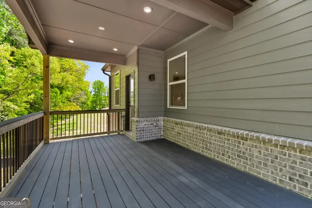 a view of a porch with wooden floor and outdoor space