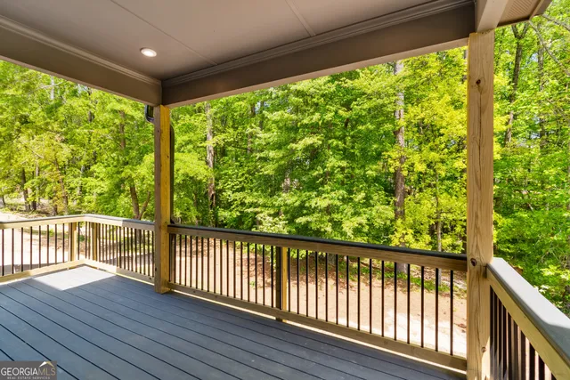 a view of a porch with wooden floor