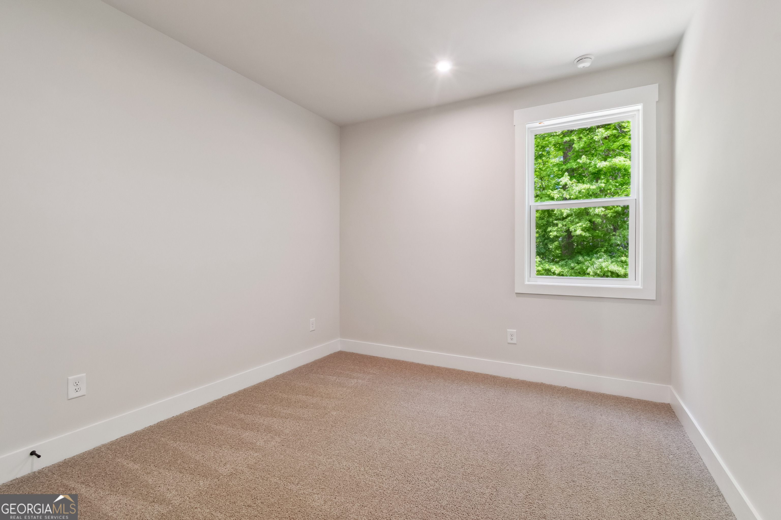 4002 Adler Circle, Unit 7 Buford, GA 30519 - Photo 19 of 38 an empty room with a window