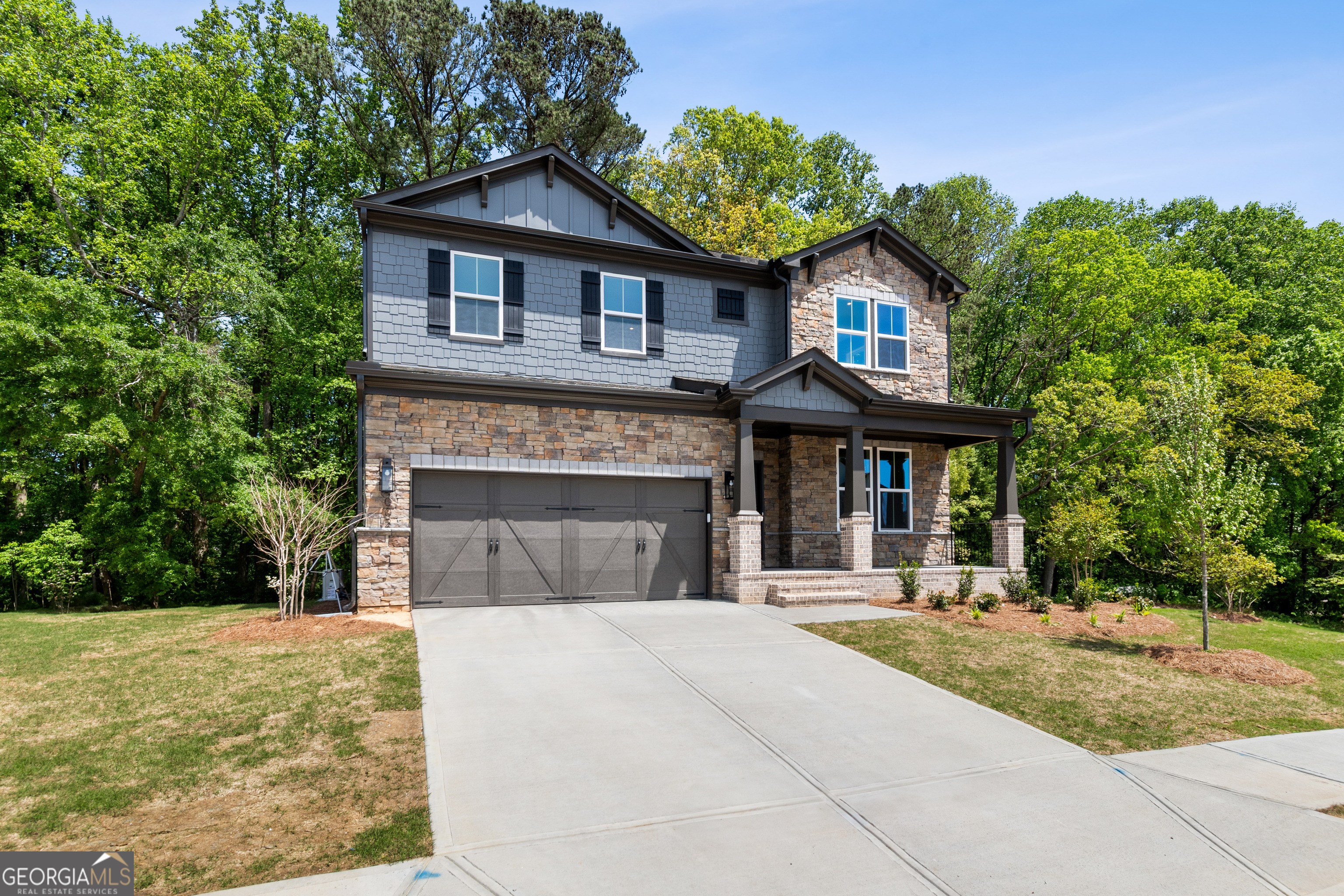 4002 Adler Circle, Unit 7 Buford, GA 30519 - Photo 2 of 38 a front view of a house with a yard