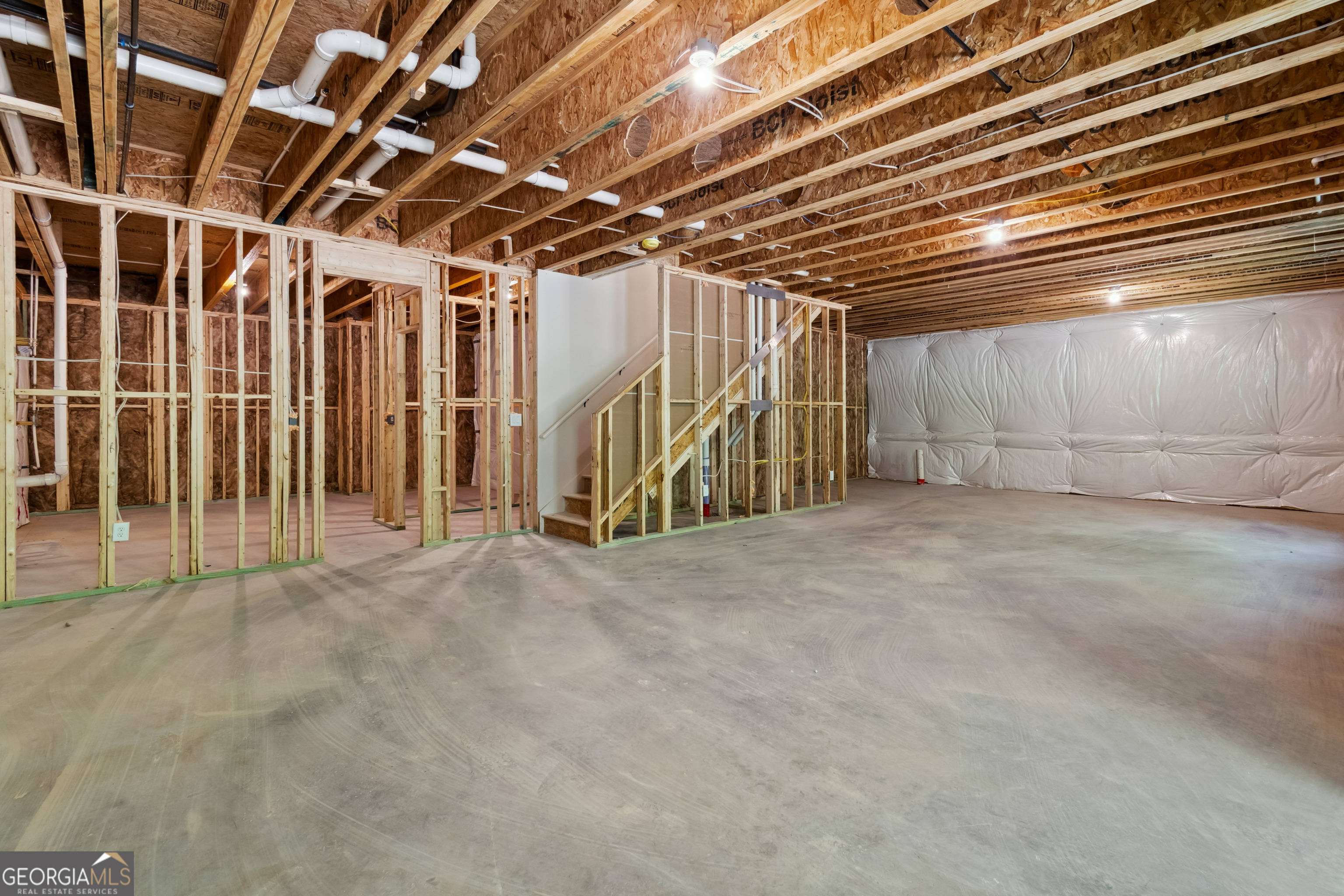 4002 Adler Circle, Unit 7 Buford, GA 30519 - Photo 34 of 38 a view of empty room with wooden ceiling