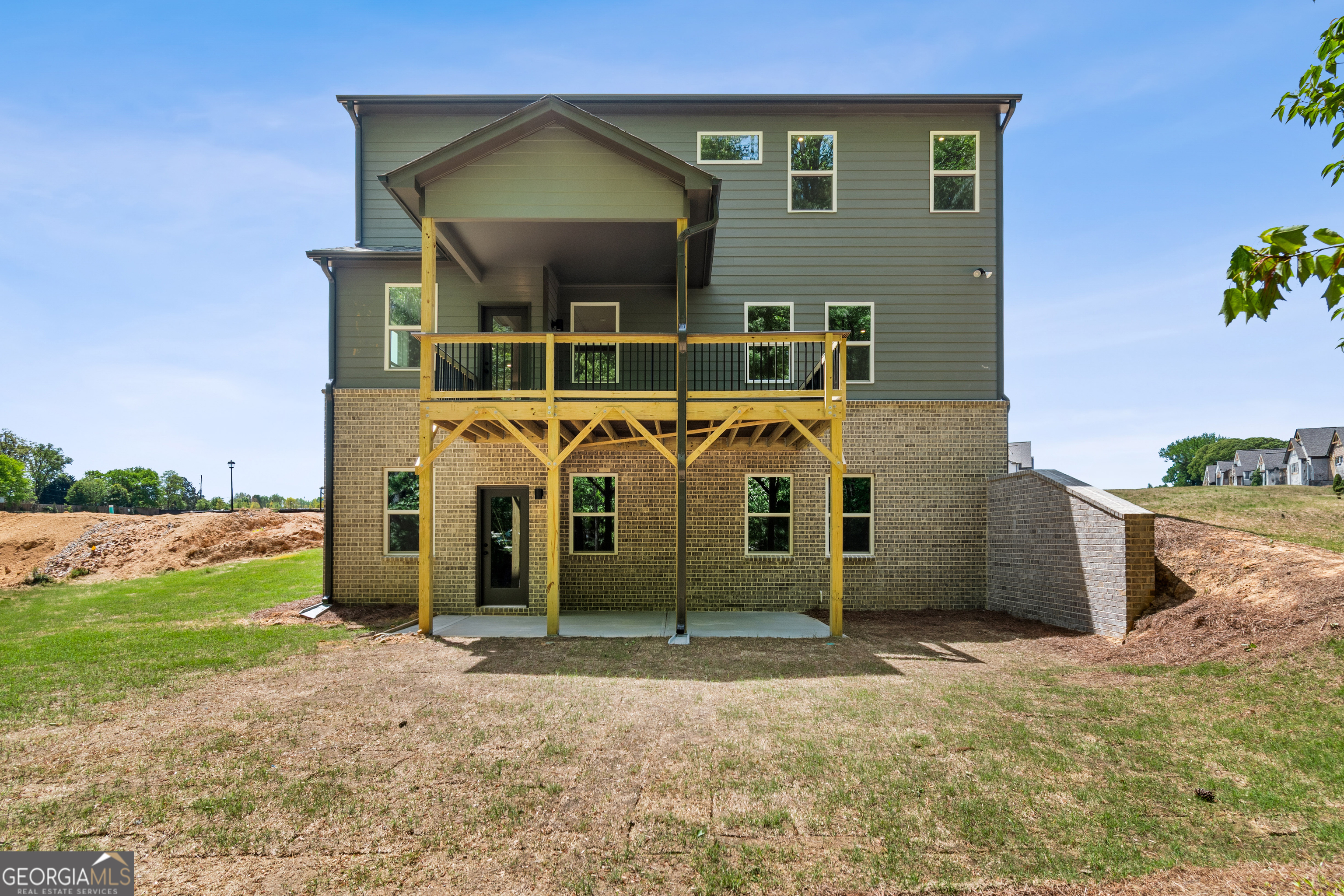 4002 Adler Circle, Unit 7 Buford, GA 30519 - Photo 36 of 38 front view of a house with a yard