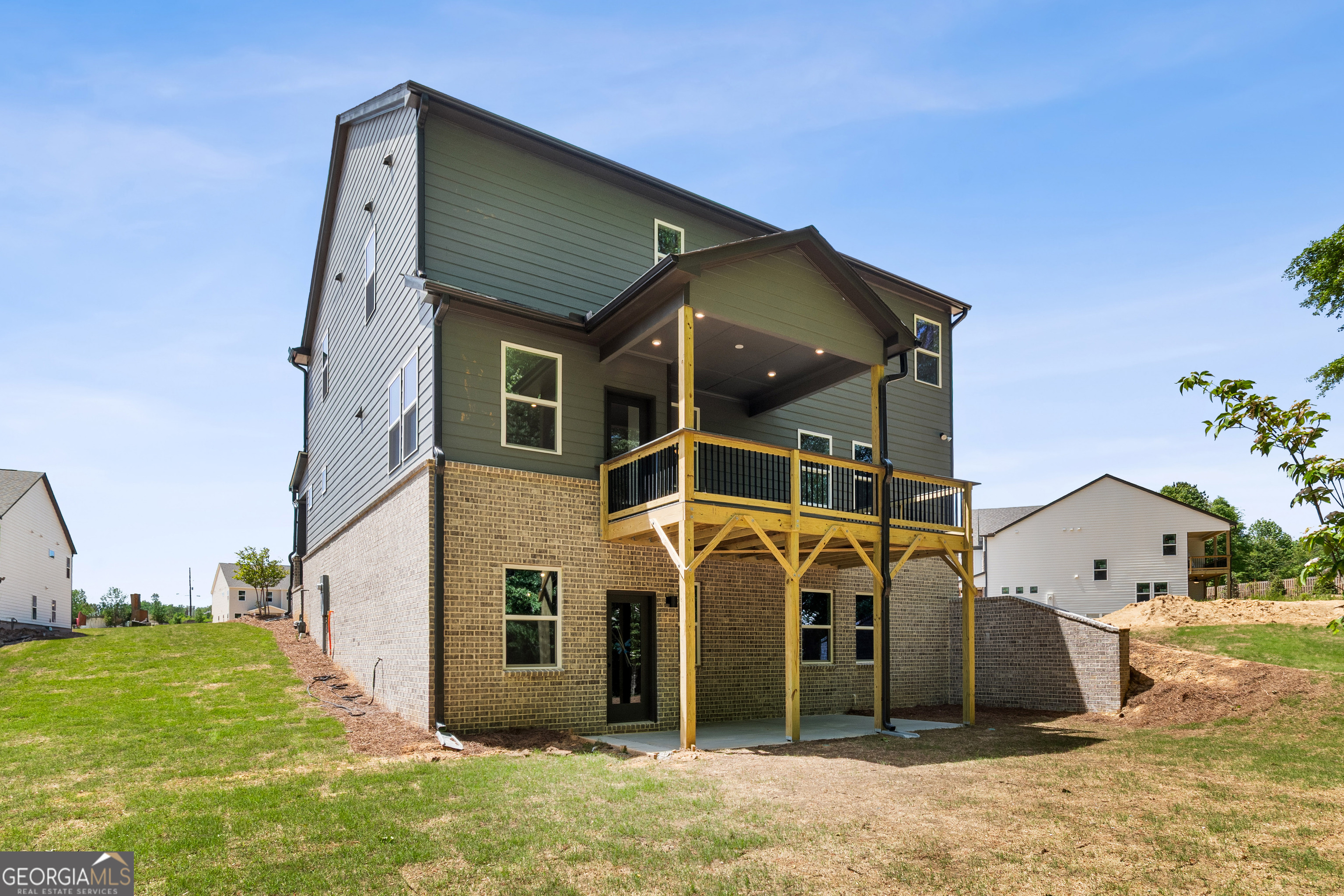 4002 Adler Circle, Unit 7 Buford, GA 30519 - Photo 37 of 38 a front view of a house with a yard