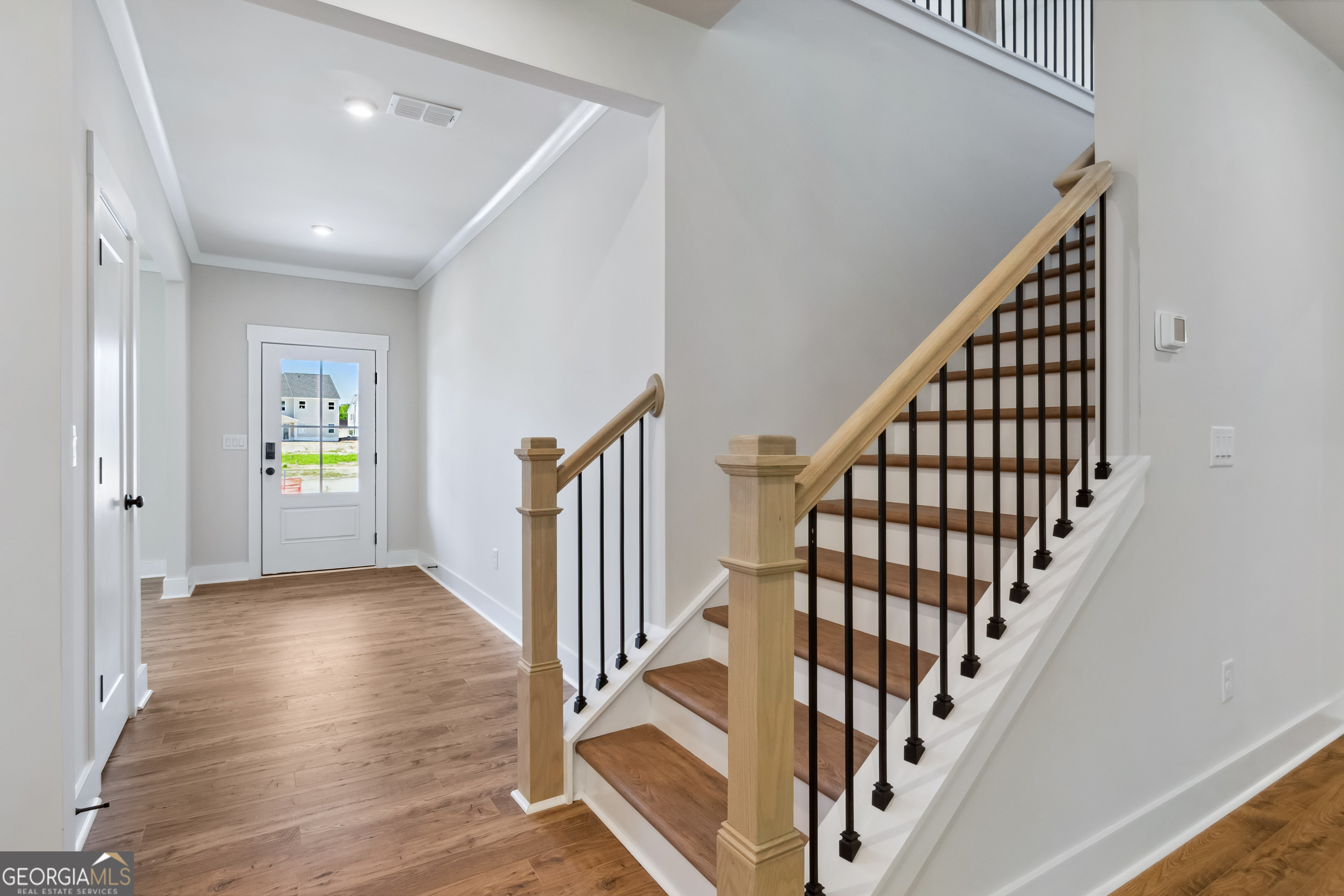 4002 Adler Circle, Unit 7 Buford, GA 30519 - Photo 6 of 38 a view of an entryway with wooden floor