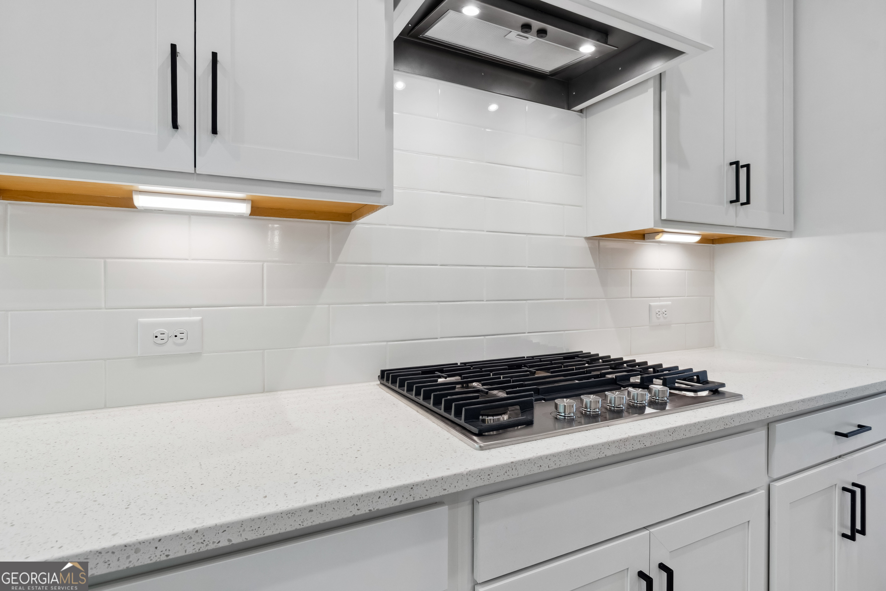 4002 Adler Circle, Unit 7 Buford, GA 30519 - Photo 8 of 38 a kitchen with a stove and a cabinets