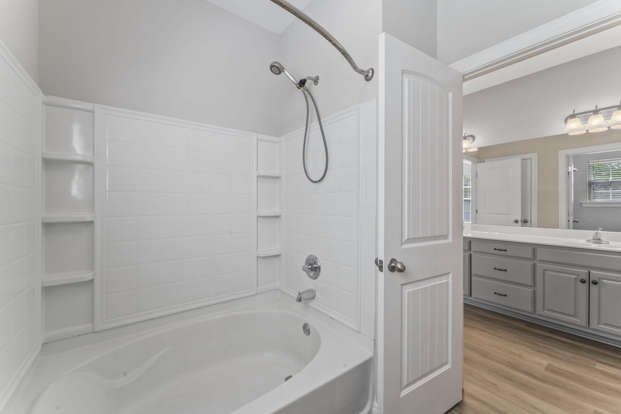 338 Rowlette Circle Murfreesboro, TN 37127 - Photo 15 of 17 a bathroom with a granite countertop bathtub shower sink and cabinets