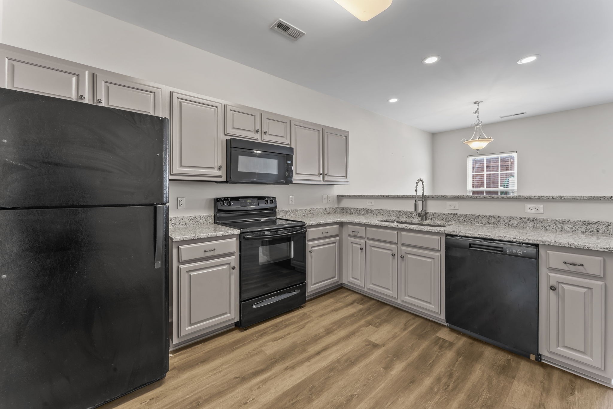 338 Rowlette Circle Murfreesboro, TN 37127 - Photo 5 of 17 a kitchen with a refrigerator and a stove top oven