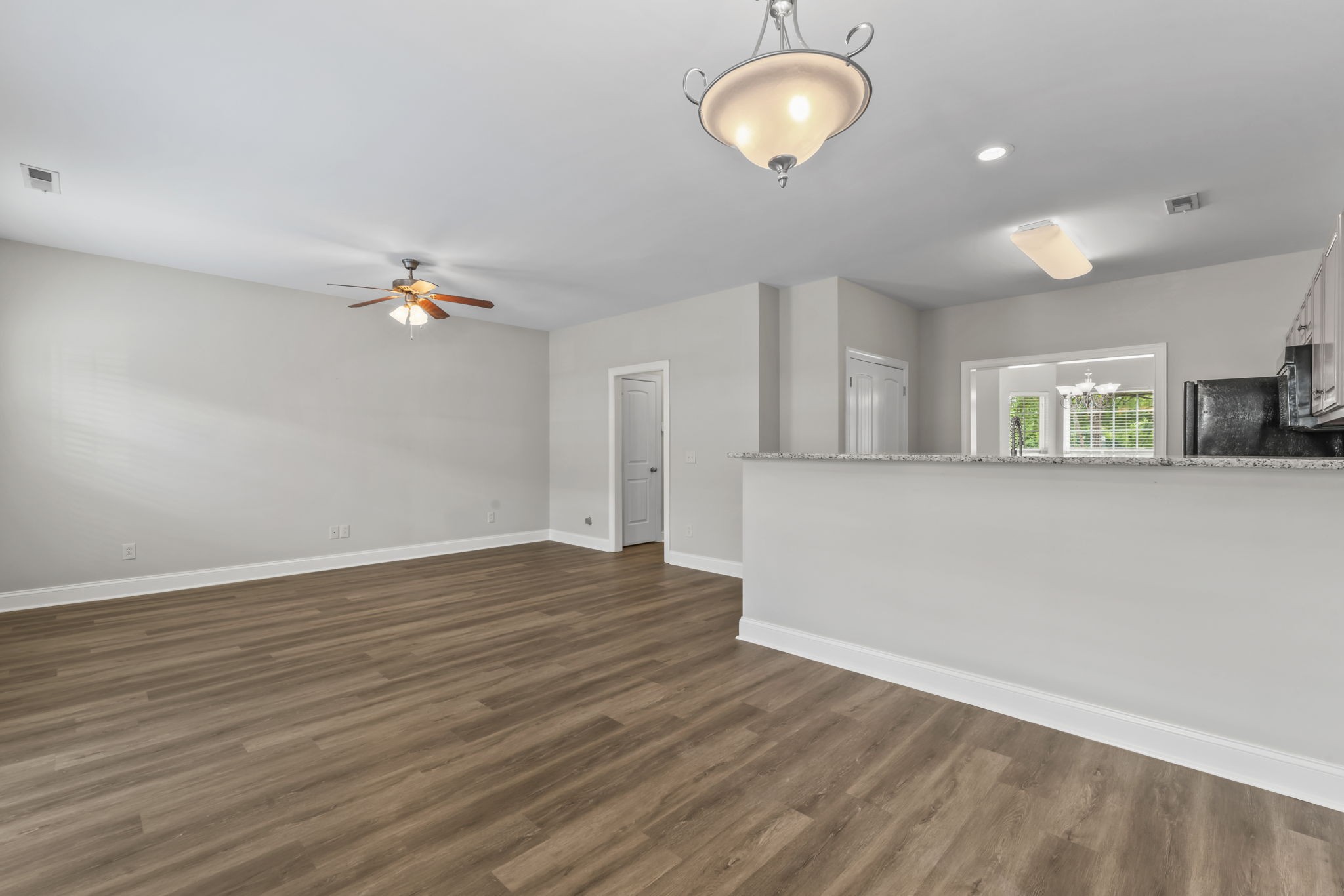 338 Rowlette Circle Murfreesboro, TN 37127 - Photo 8 of 17 an empty room with wooden floor and windows