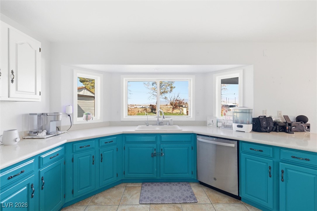 2570 East Kellogg Road Pahrump, NV 89048 - Photo 15 of 54 Large, open kitchen area with beautiful views. Newer stainless steel dishwasher and stove.