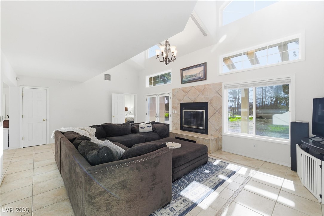 2570 East Kellogg Road Pahrump, NV 89048 - Photo 18 of 54 Large living room boasts wood-burning fireplace.