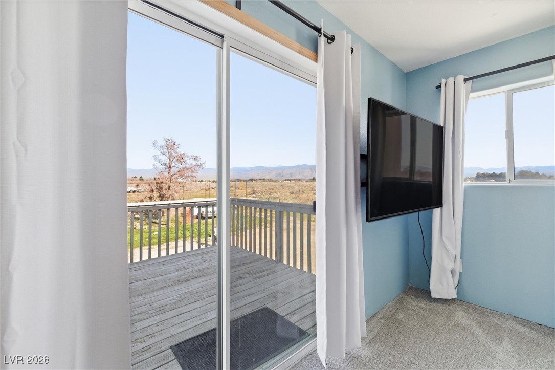 2570 East Kellogg Road Pahrump, NV 89048 - Photo 32 of 54 Access from primary bedroom to private balcony.
