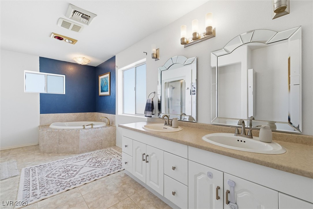 2570 East Kellogg Road Pahrump, NV 89048 - Photo 34 of 54 Double sink, soaker tub, walk-in shower.