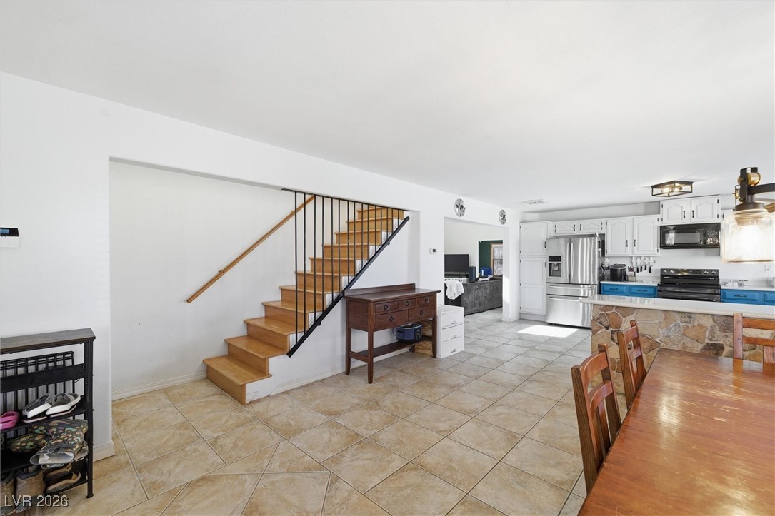 2570 East Kellogg Road Pahrump, NV 89048 - Photo 9 of 54 Open to kitchen. Large dining room.