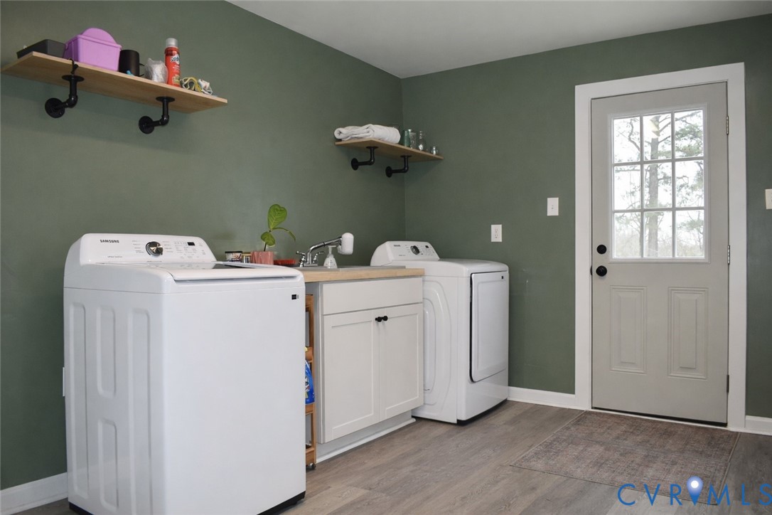 5521 Richmond Road Amelia Court House, VA 23002 - Photo 11 of 28 Laundry room featuring cabinet space, light wood-t