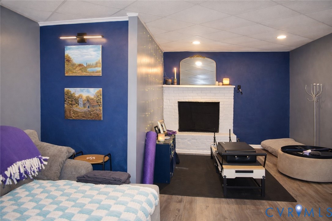 5521 Richmond Road Amelia Court House, VA 23002 - Photo 15 of 28 Bedroom featuring a brick fireplace, wood finished