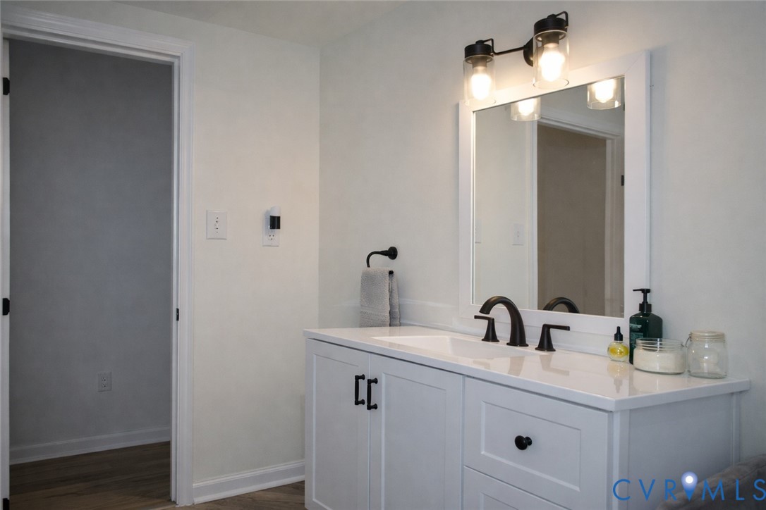 5521 Richmond Road Amelia Court House, VA 23002 - Photo 20 of 28 Bathroom featuring vanity and dark wood-style floo