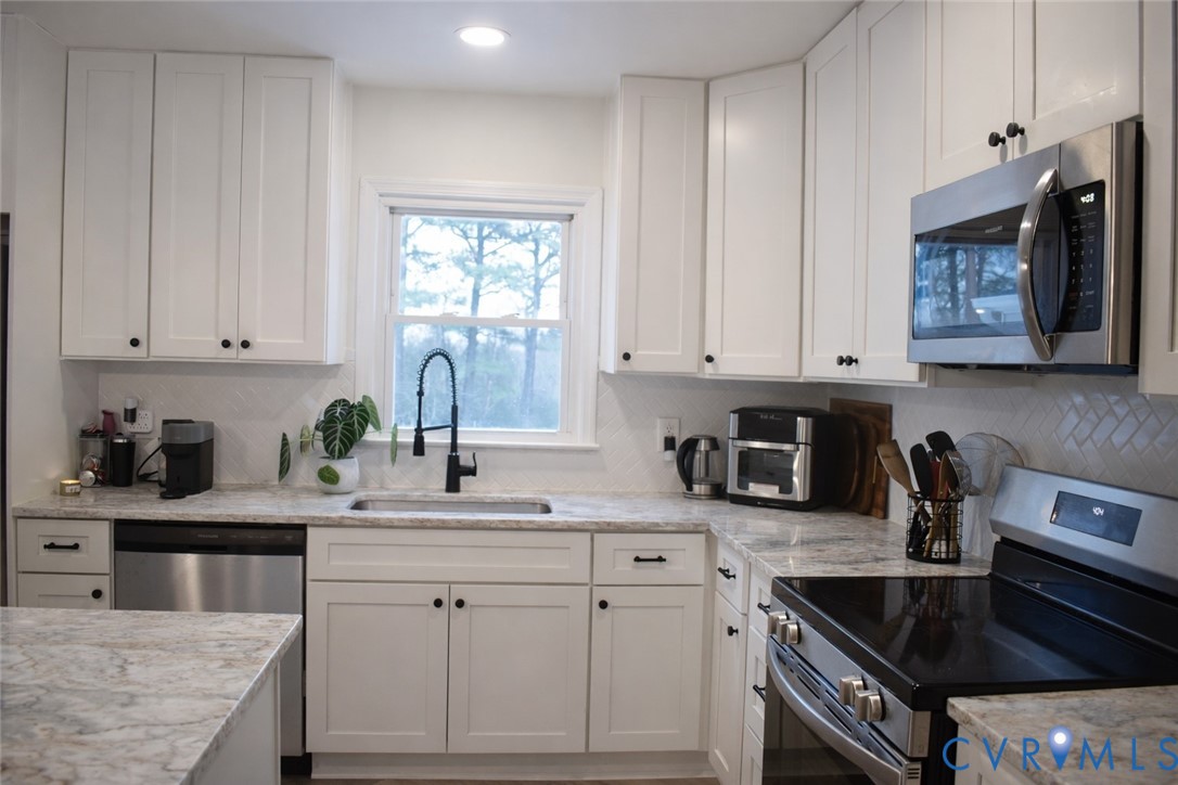5521 Richmond Road Amelia Court House, VA 23002 - Photo 9 of 28 Kitchen with stainless steel appliances, white cab