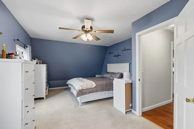 a bedroom with furniture and a baby crib