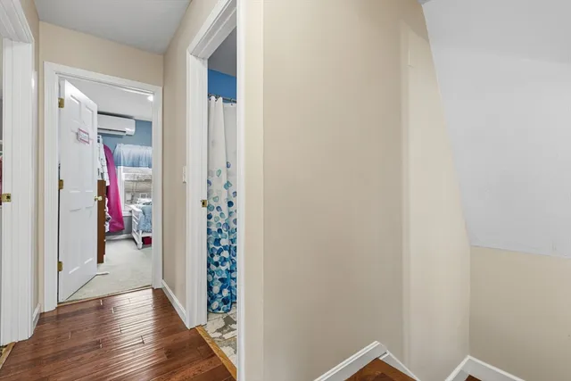 a bedroom with a bed and a mirror