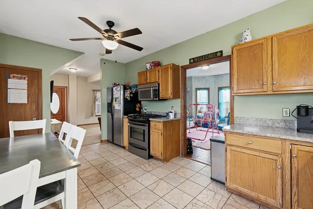 a kitchen with a stove a sink and a microwave