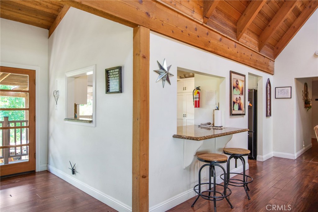 7241 Old Temescal Road Corona, CA 92881 - Photo 30 of 47 a view of a hallway with wooden floor and dining room