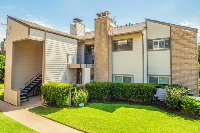 a front view of a house with yard