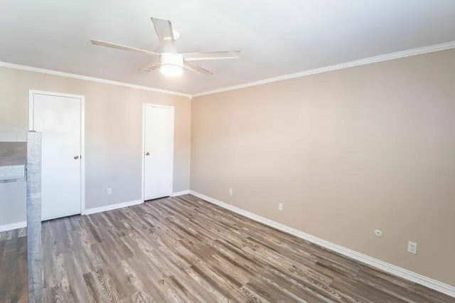 a view of room with wooden floor