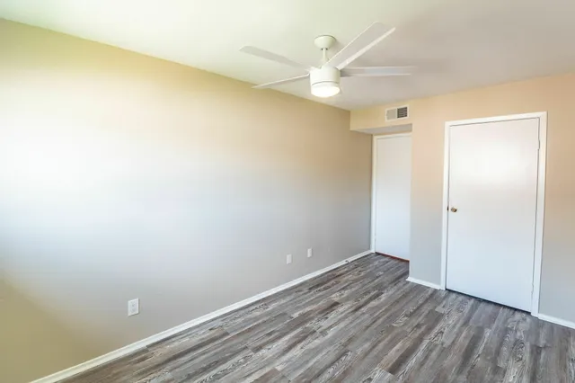 a view of room with wooden floor