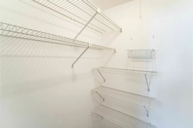 a view of a room with racks on the wall