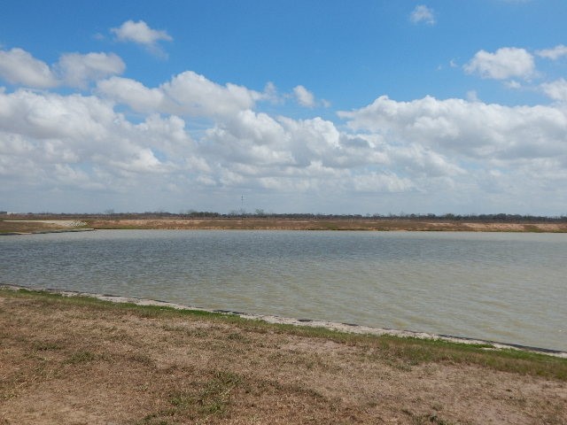 2095 Mule Ridge Drive Katy, TX 77493 - Photo 6 of 9 a view of a lake and mountain in the back