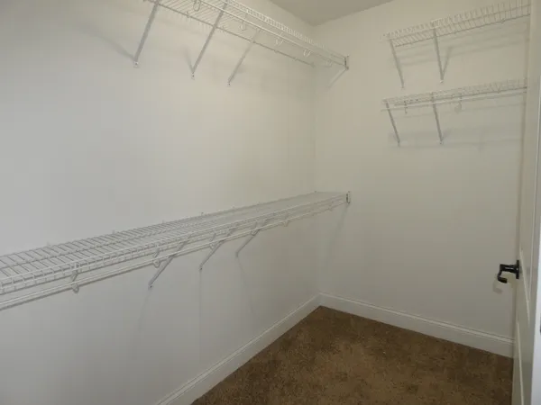 a view of a room with white racks