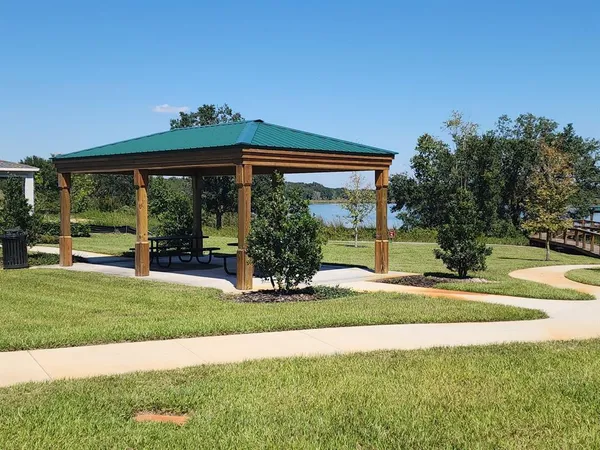 a view of a house with backyard and porch