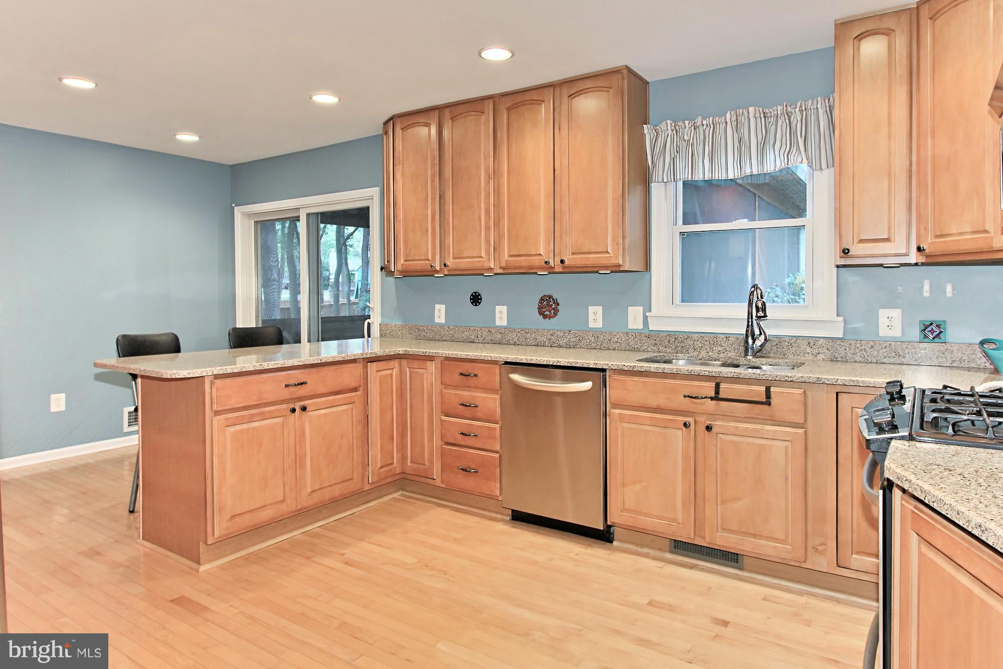 2309 Ballycairne Court Reston, VA 20191 - Photo 9 of 29 Kitchen with Wood Floors + Recessed Lights
