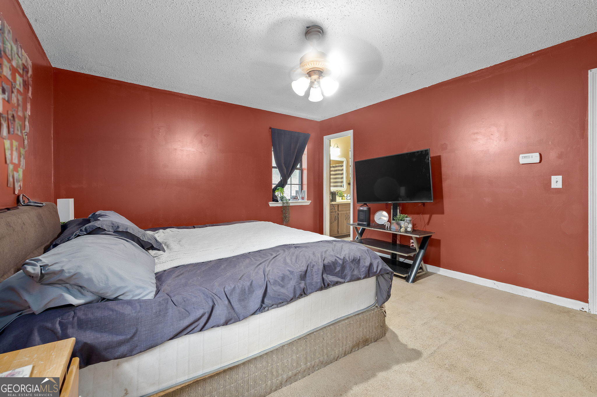 89 Ts Jarrard Road Dahlonega, GA 30533 - Photo 15 of 48 a bedroom with a bed and a flat screen tv