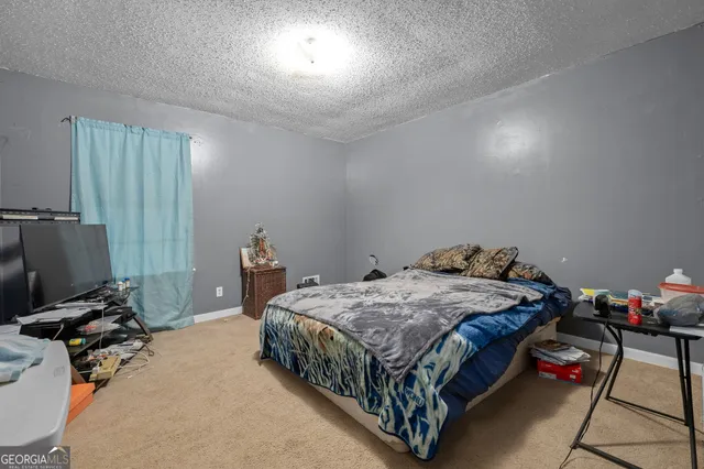a view of workspace with furniture and window
