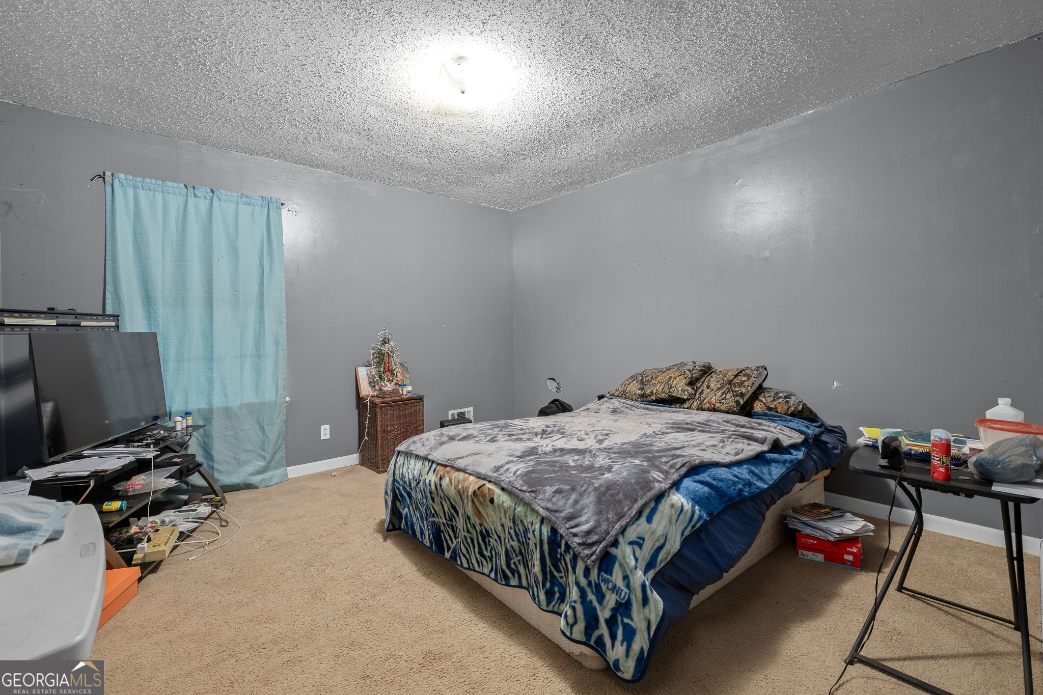 89 Ts Jarrard Road Dahlonega, GA 30533 - Photo 17 of 48 a bedroom with a bed and a window