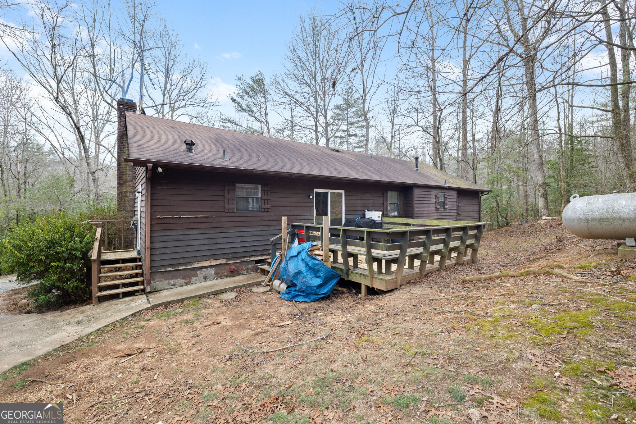 89 Ts Jarrard Road Dahlonega, GA 30533 - Photo 26 of 48 a front view of a house with garden