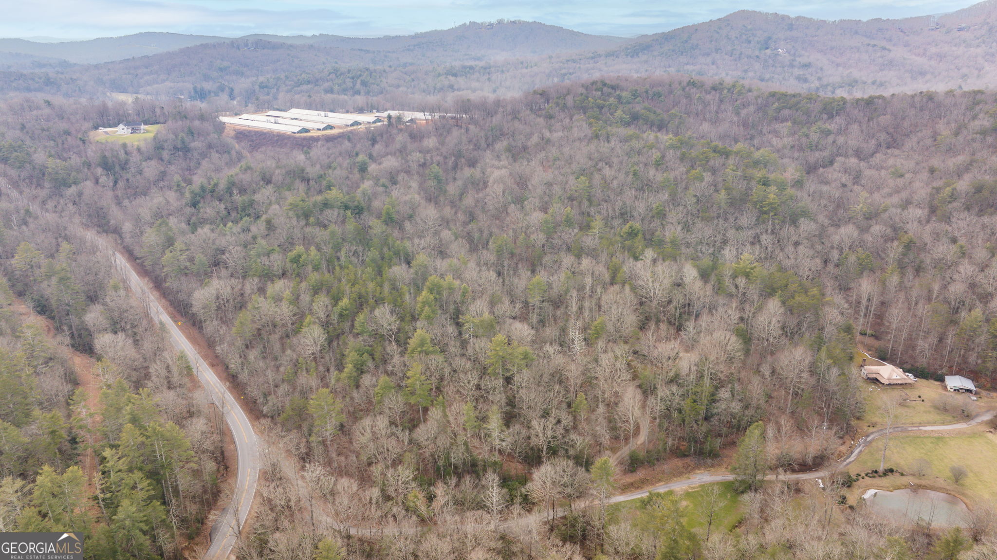89 Ts Jarrard Road Dahlonega, GA 30533 - Photo 38 of 48 a view of a dry space with mountains in the background