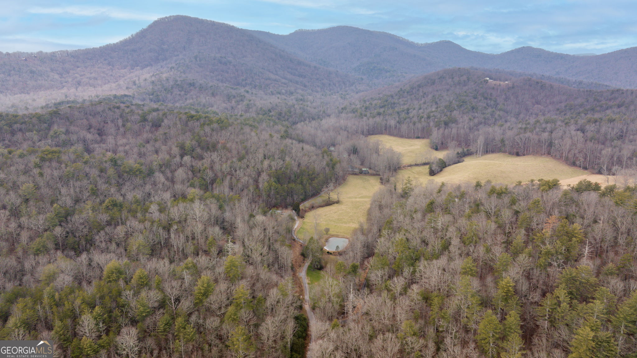 89 Ts Jarrard Road Dahlonega, GA 30533 - Photo 39 of 48 a view of a lush green hillside and a houses