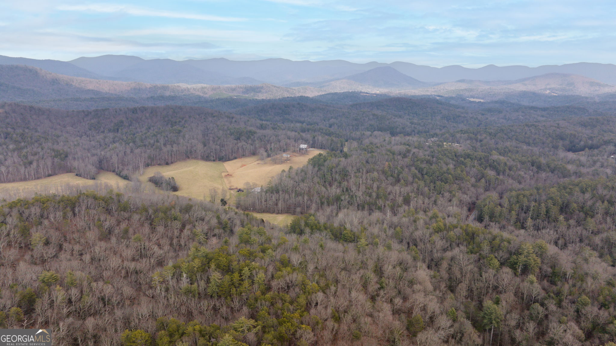 89 Ts Jarrard Road Dahlonega, GA 30533 - Photo 45 of 48 a view of a dry yard with mountains in the background