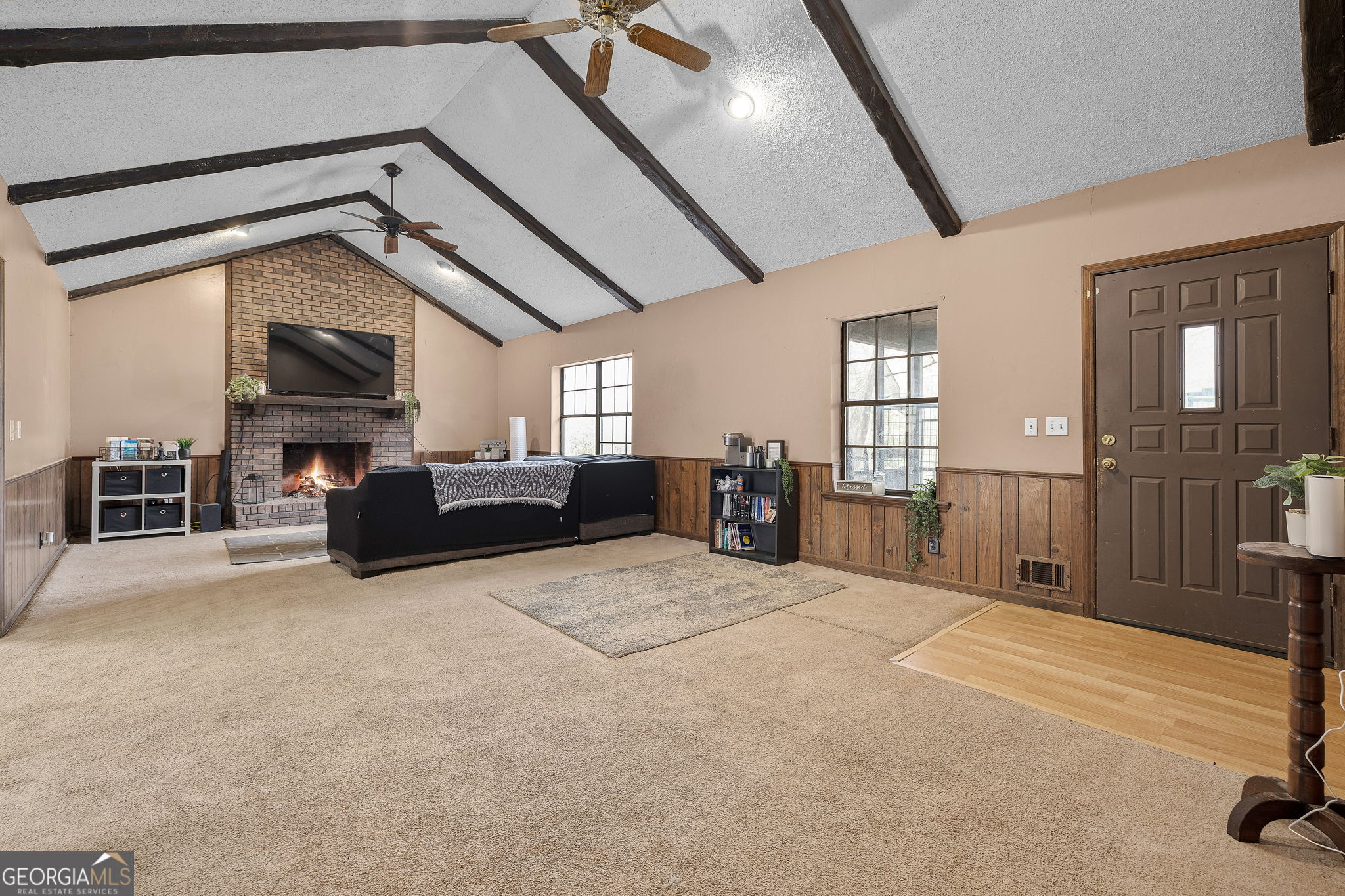 89 Ts Jarrard Road Dahlonega, GA 30533 - Photo 7 of 48 a living room with furniture and a flat screen tv